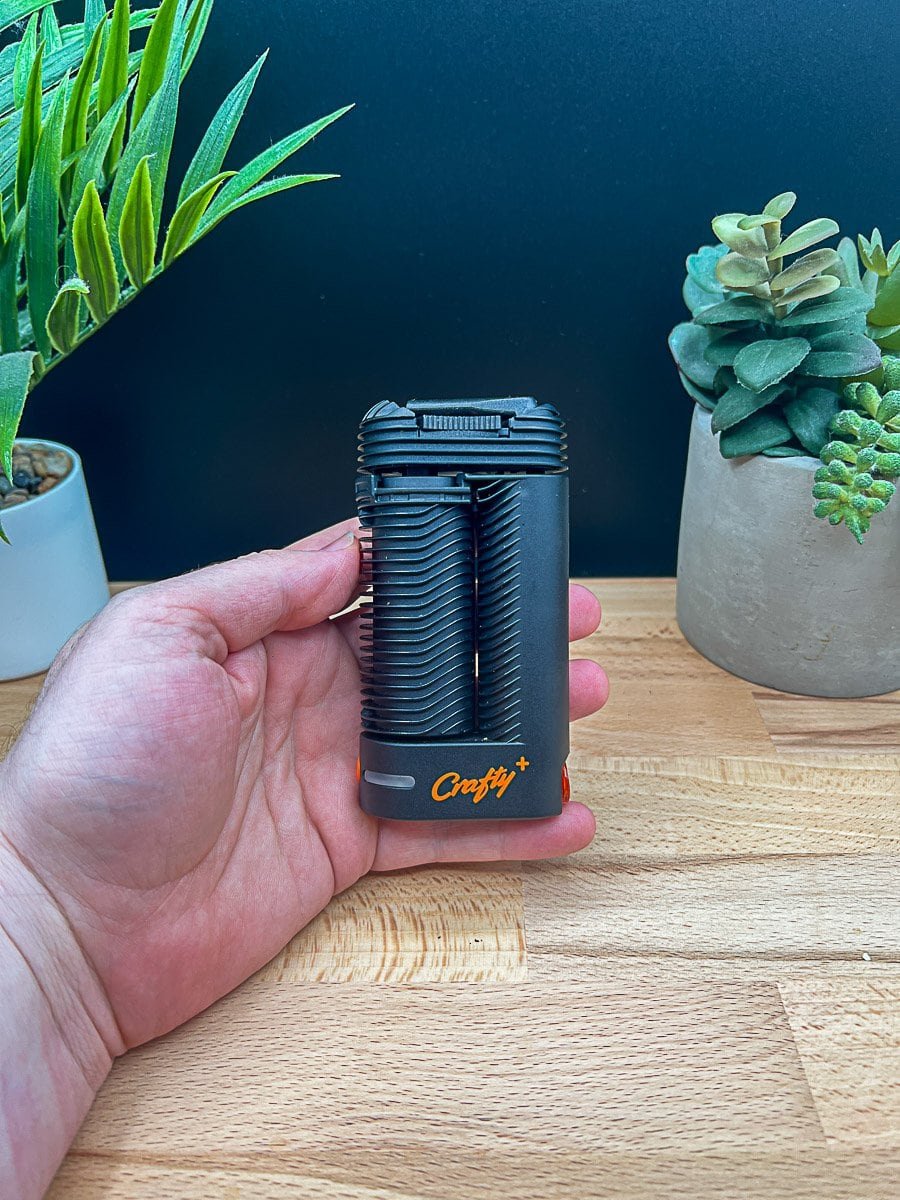 Crafty+ (Plus) portable dry herb vaporizer by Storz & Bickel on wooden table – featured in Crafty+ Review 2025